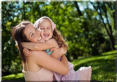 Mother and daughter hugging smiling