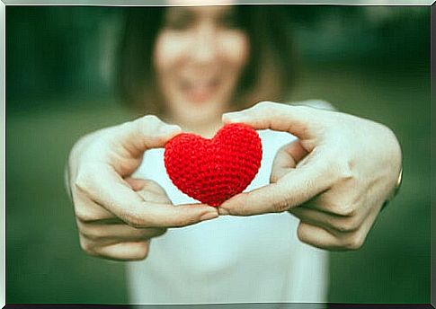 Woman holding a heart symbolizing how to develop patience