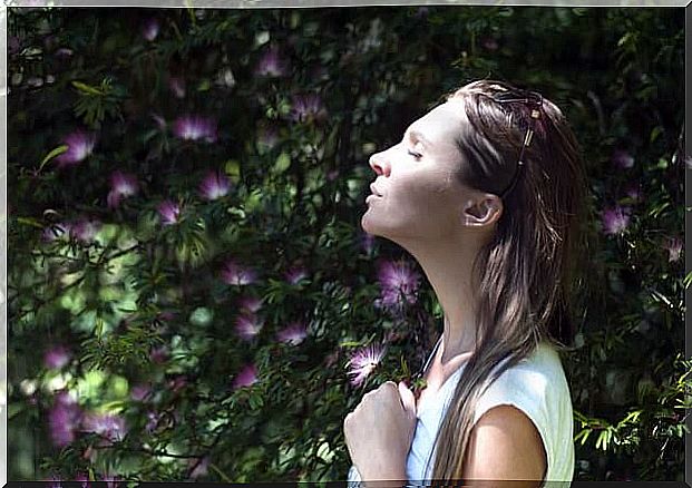 Woman breathing with eyes closed