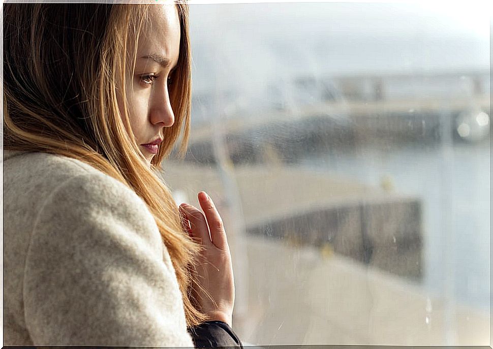 Woman looking out the window