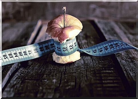 Apple with meter around representing anorexia