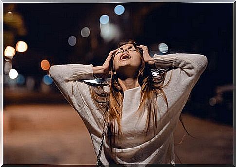 Woman screaming in the street feeling angry