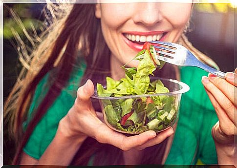 Woman eating salad