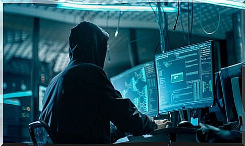 Man with a computer doing doxing