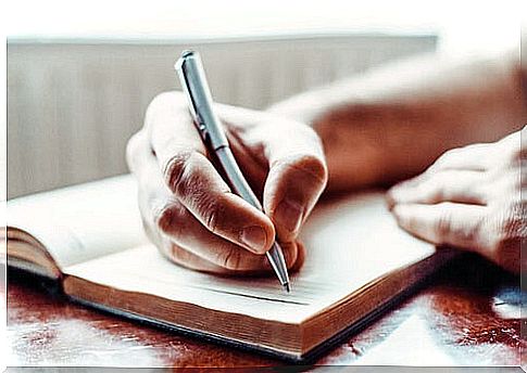 Hand writing handwritten notes on a blank sheet