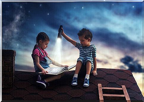 Boy reading on roof