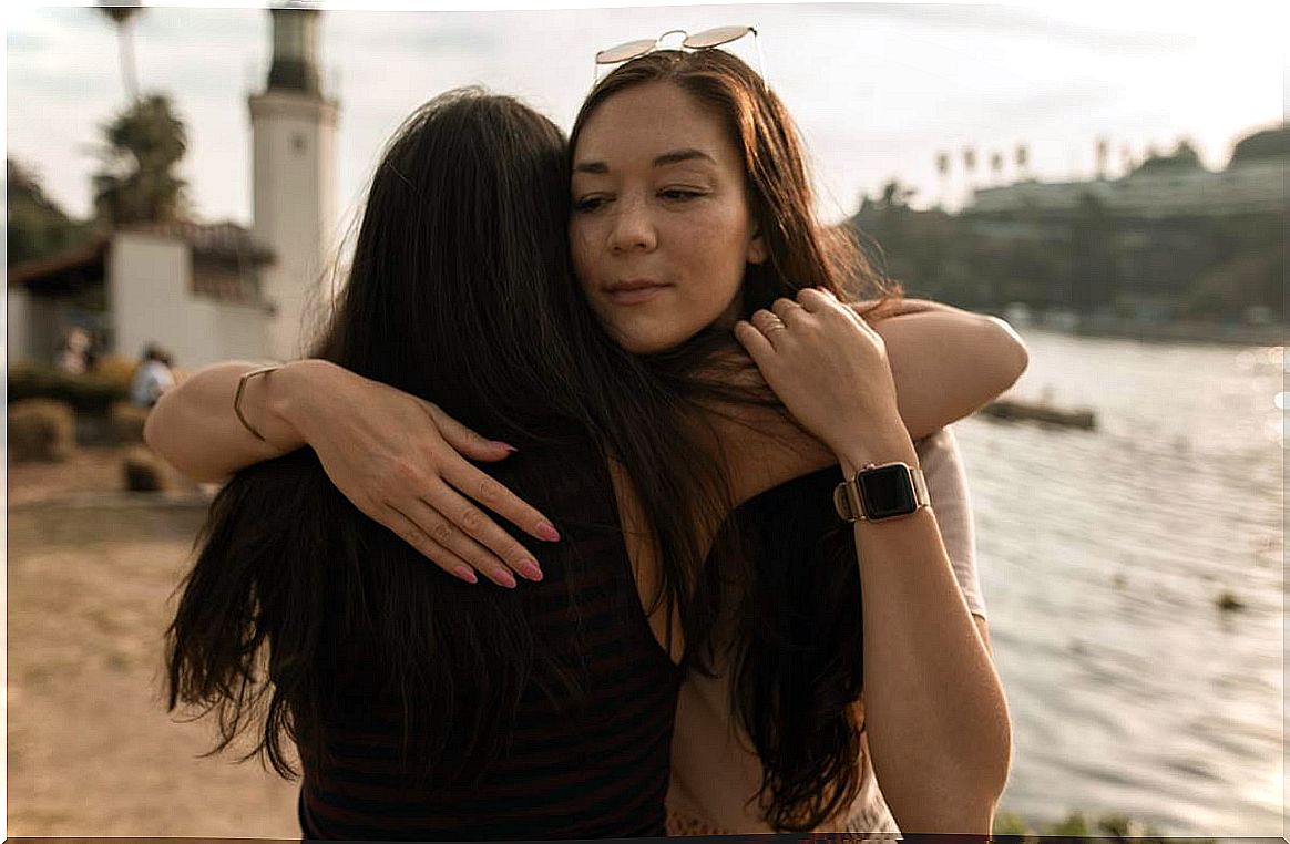 Girlfriends hugging symbolizing liquid friendships