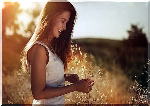 happy woman in the countryside living as she wants