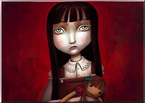 Sad girl with doll