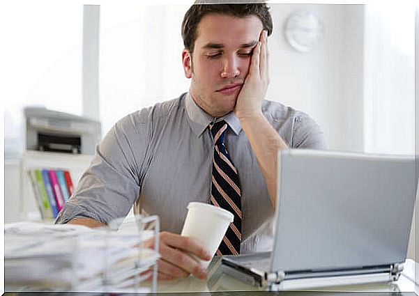 Bored man at work and emotionally burned out