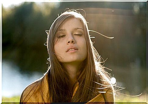 Woman with closed eyes knowing herself