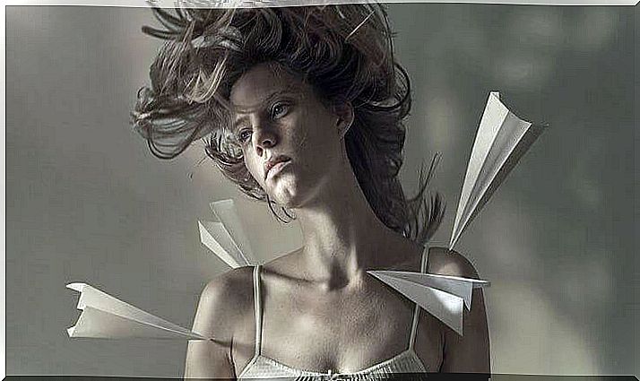 woman with paper airplanes on her body