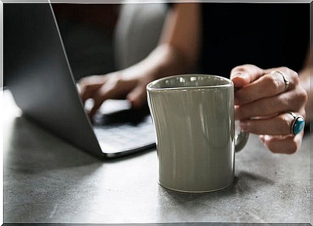 Woman with a computer doing teletherapy