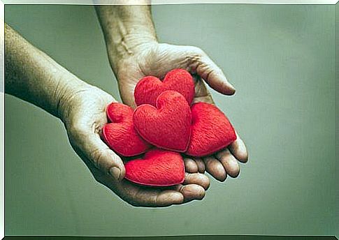 Hand offering hearts with empathy