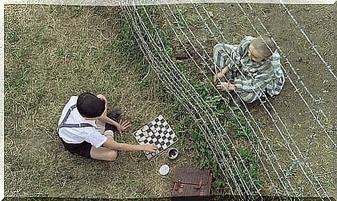 Boy in the striped pajamas with his friend