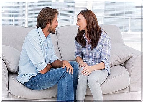 Couple chatting in living room