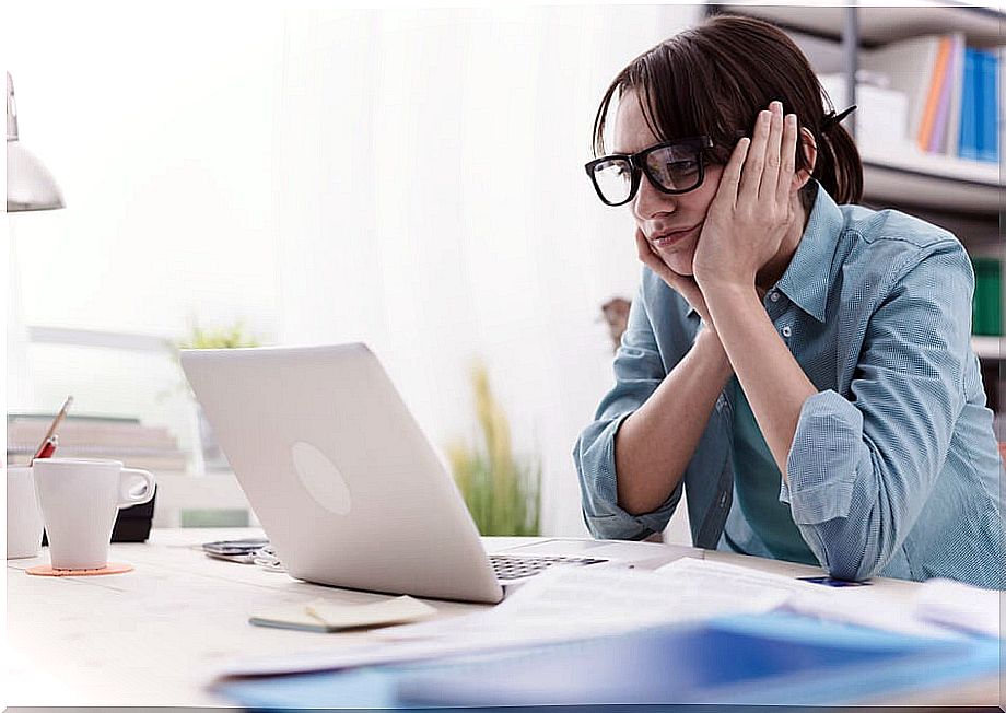 Bored woman looking at computer