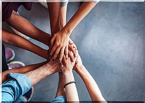 Hands of a group of people united