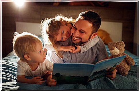 Father reading a story with his children