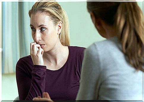 Woman listening to another who is angry